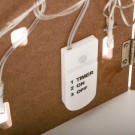 Hus på rekke med lys thumbnail