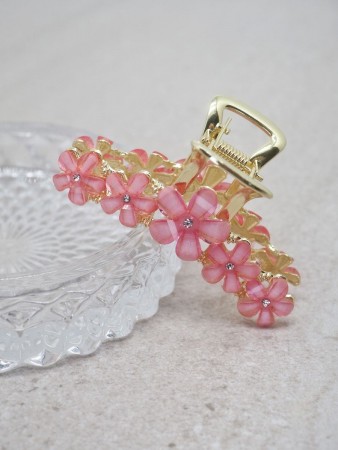 Hårklype med blomsterstener korall